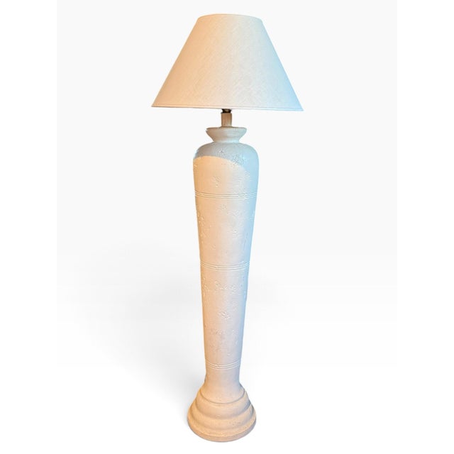 A striking vintage 1980s Sun 89 sculptural plaster floor lamp, featuring a tall, architectural column with layered...
