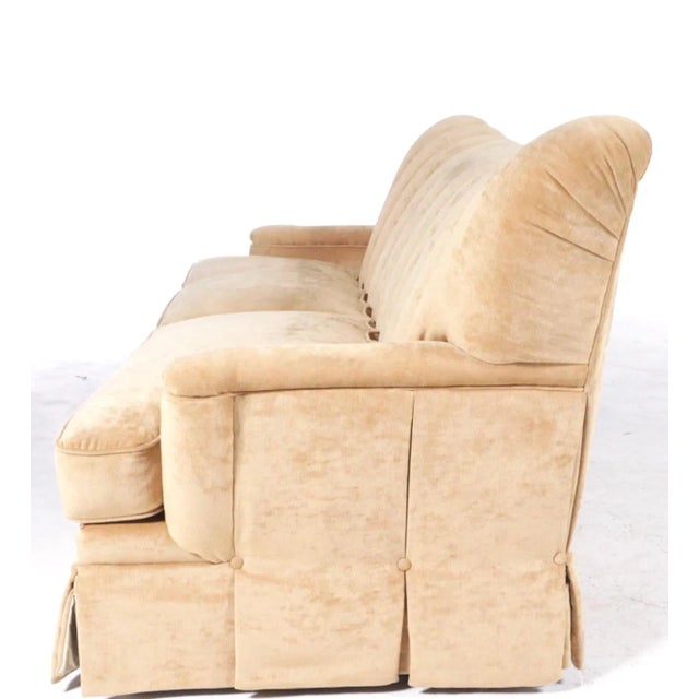 Restored and rich camel velvet upholstered, tall back Art Deco sofa. The tall and deep channel back, with and slight...