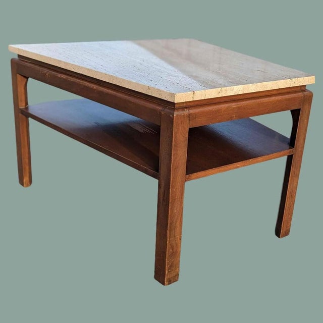 Bring timeless design into your home with this Mid-Century Modern side table in walnut and travertine. Design Highlights:...