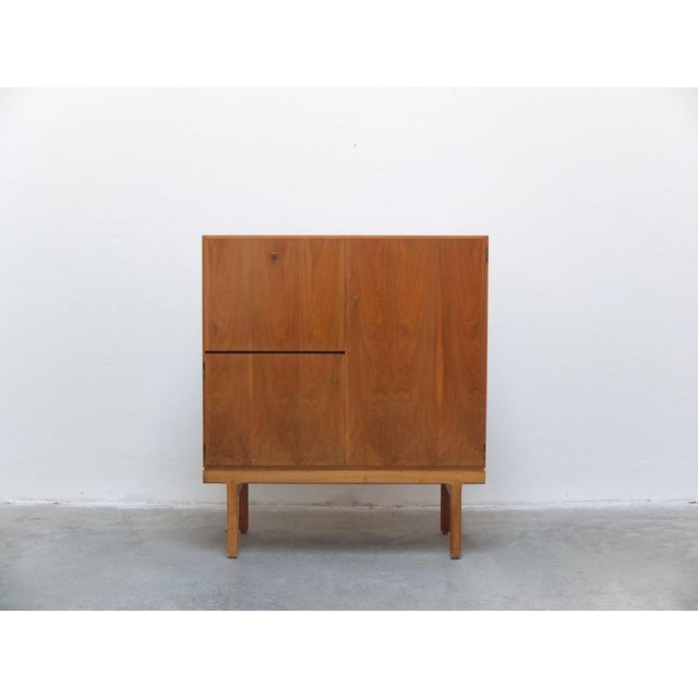 Beautiful bar cabinet from the ‘Abtracta’ series designed by Jos De Mey around 1960. Made of walnut with a very decorative...