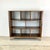 A striking piece of contemporary shelving with a graphic zebrawood veneer that commands attention. The asymmetric layout —...