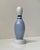 A rare ornament of a bowling pin. Executed in glazed white porcelain with blue accents/stripes. Dessin number 6132 by Bing...