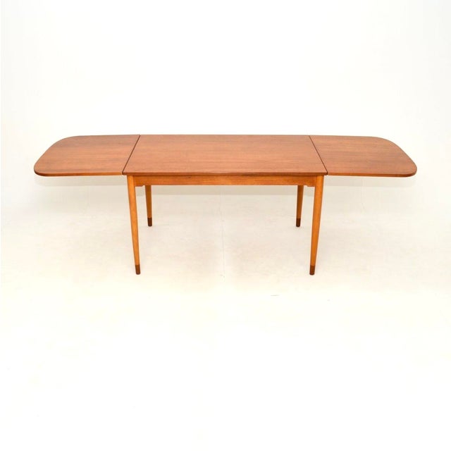 A stunning and rare Danish teak vintage drop leaf dining table by Borge Mogensen. This was made in Denmark by Soborg...