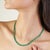 The deep, glossy green onyx stones are precisely set to create a seamless and luxurious look. With a substantial total...