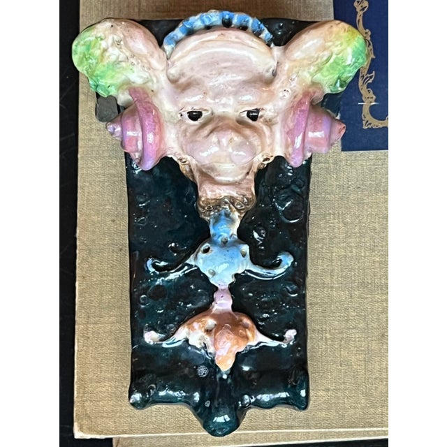 Antique gargoyle wall sconce in majolica finish. Wire attached to the reverse for wall hanging. This could easily hold a...