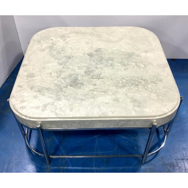 Stylish modern gray and ivory resin cocktail table, polished nickel base, showroom floor sample