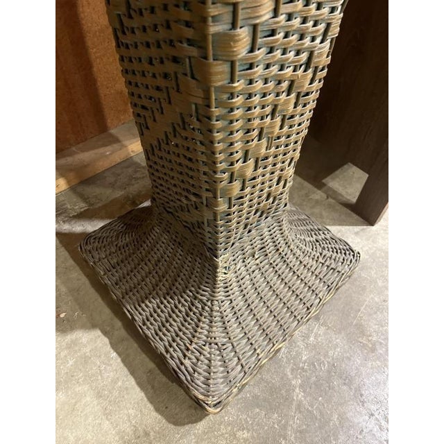 Antique Wicker Pedestal/Plant Stand measures 13 x 13 at top and 15 x15 inches at the bottom.