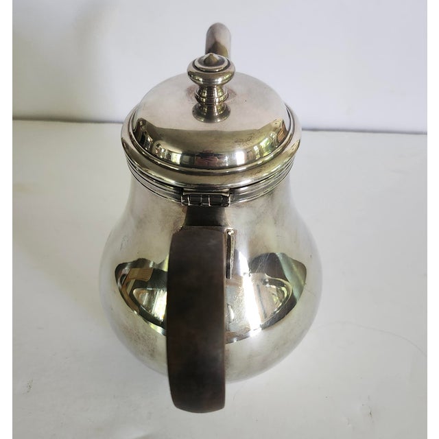 The Christofle France Bagatelle Silverplate Teapot with Ebony Wooden Handle is a stylish and elegant tea/coffee pot with a...