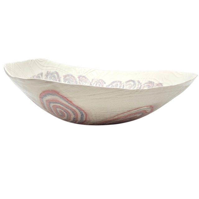 This large-scale organic centerpiece bowl is defined by its thinly rolled body and rhythmic, hand-impressed abstract...