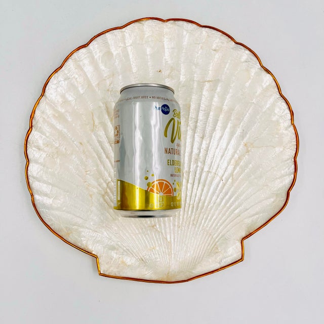 Lovely vintage capiz shell large tray or dish with brass banding. Measures 11"w x 11"d x .75"h.