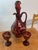 A magnificent antique bohemian etched glass decanter with two matching glasses. Cranberry red to clear glass bottle with...