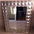 This striking Italian mirror with a bold geometric faceted carved frame in solid wood and finished with a silvered...