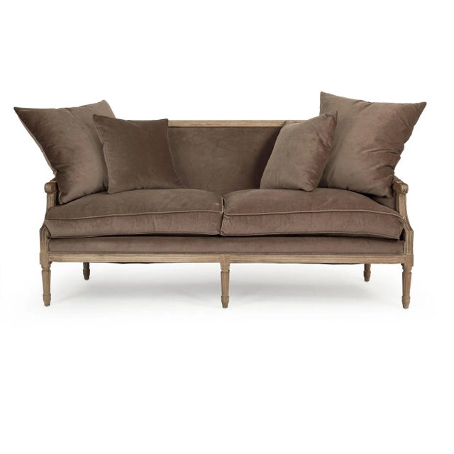 Louis sofa upholstered in brown velvet on limed grey oak frame.