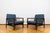A pair of club chairs "type b7522," designed by zenon bączyk and produced in poland in the 1960s, exemplifies the...