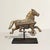This early 20th-century cast iron running horse captures motion in its most distilled, industrial form—an object once...