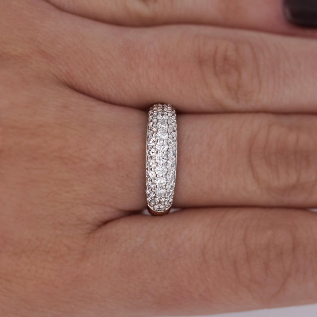A timeless platinum pave diamond band featuring a sleek dome shape and 1.05 carats of sparkling diamonds—perfect for...