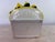 This is a large vibrant pottery lemon topiary. This decorative pottery bowl of lemons has a white classical urn base with...