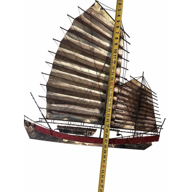 A dramatic signed vintage C. Jeré/Artisan House Chinese junk boat wall sculpture, handcrafted from brass, steel, and mixed...