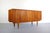 1970's teak sideboard by Bernhard Pedersen. The two tambour fronted doors slide open to reveal three central drawers which...