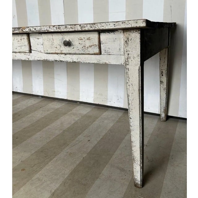 19th Century French Painted 8 Drawer Farm Table with great patina, including a very interesting burn mark that would make...