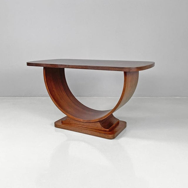 Italian Art Deco wooden coffee table with semicircle legs, 1930s Coffee table with rectangular wooden base. The top has...