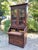 An 1880s era Victorian period Walnut cylinder roll top secretary desk and bookcase with matched burl wood panels, a pull-...