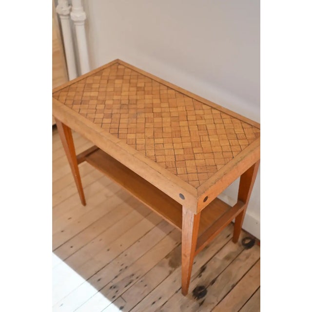 A Paul Laszlo "Basketweave" style mid century modern side table. A cool piece! The tabletop is inlaid with tessellated...