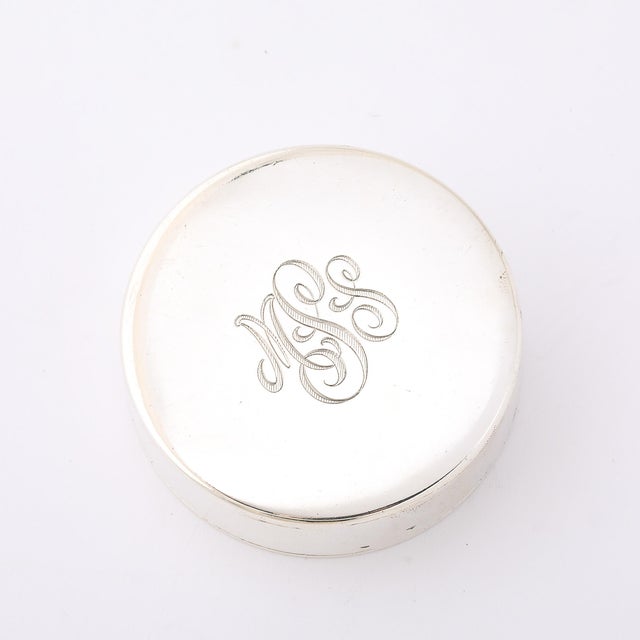 The Art Deco Minimal Sterling Silver Pill Box, crafted in America during the 20th century, exemplifies the refined...