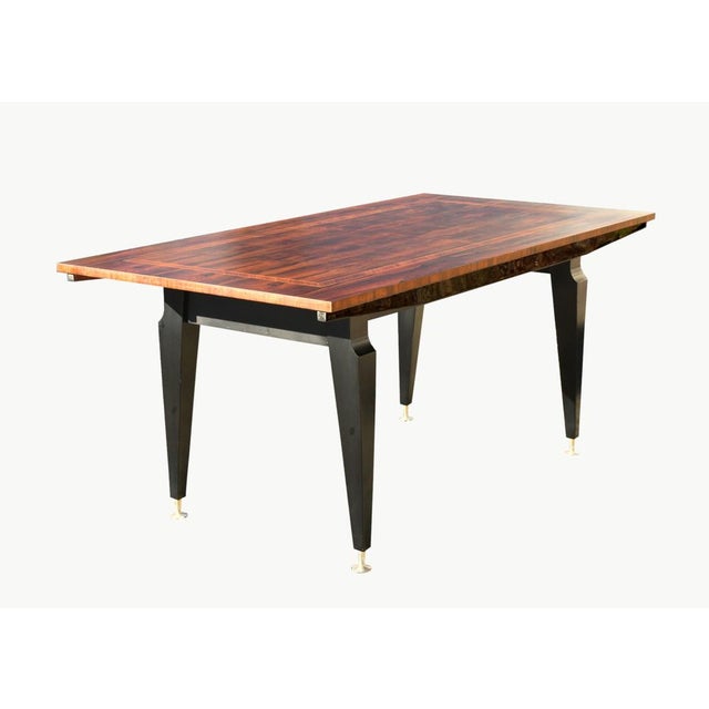 A stylised inlaid Rosewood Dining Table with a well-figured book-matched top in rosewood veneer (Dalbergia stevensonii /...