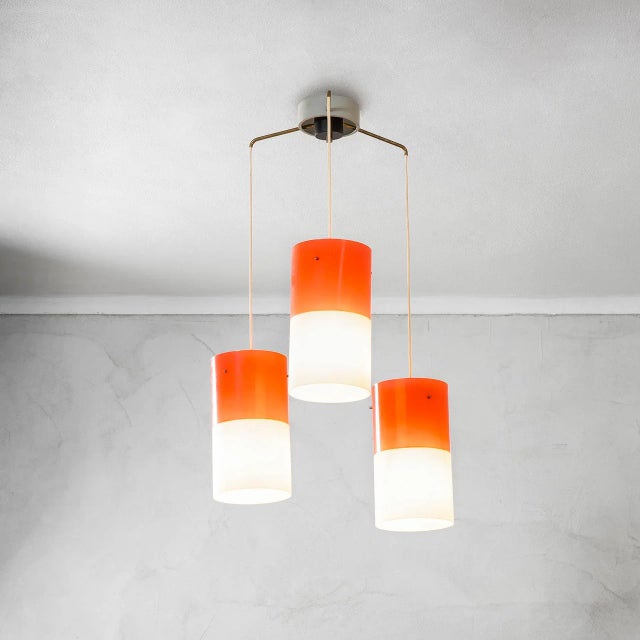 Chandelier with Three Acrlyic Glass and Brass Pendants from Stilnovo, 1960s, in Good conditions. Designed 1960 to 1969...