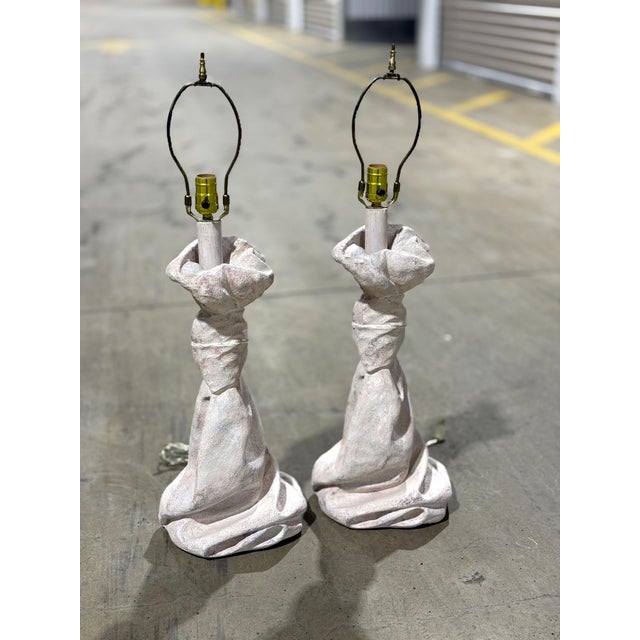 A captivating pair of vintage table lamps in the iconic manner of designer, John Dickinson. These sculptural pieces are...