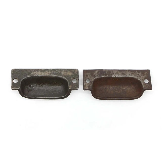 Antique Victorian style cup bin drawer pulls made of cast iron with a black finish. Original mounting screws are not...
