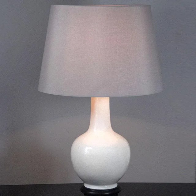 Beautiful vintage lamp from the seventies of the twentieth century. Made in Italy. Base with glossy white glazed ceramic...