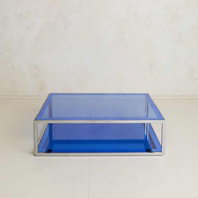 An Italian coffee table from the 1970s, attributed to Cristal Arte. The rectangular form stretches just over four feet in...