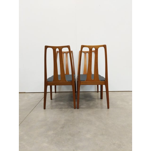Set of 4 authentic vintage mid century modern dining chairs. By Nathan Furniture. Maker's label on bottoms. This set is in...