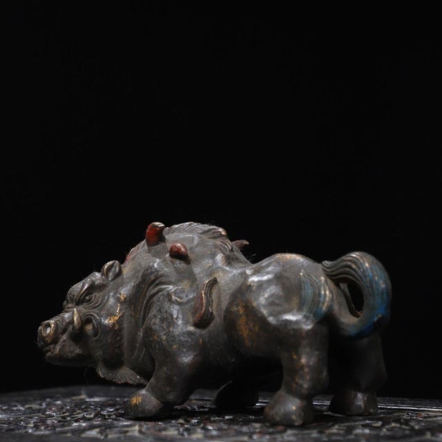 This is a finely cast antique gilt bronze sculpture of a wild boar, a figure often associated with strength and courage in...