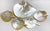 This is a set of gold-lipped mother of pearl dishes and spoons used for serving and consuming caviar. Presumably this type...