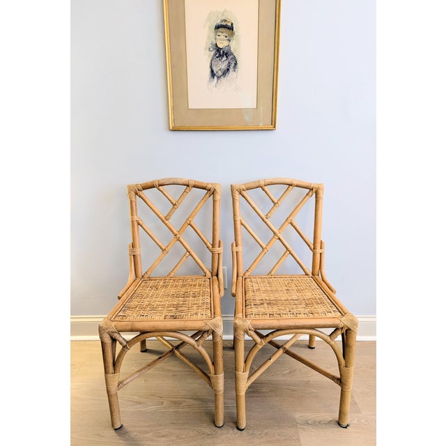 This is a lovely pair of mid-20th-century (60s, 70s) chairs in the classic Chinese Chippendale style, characterized by...