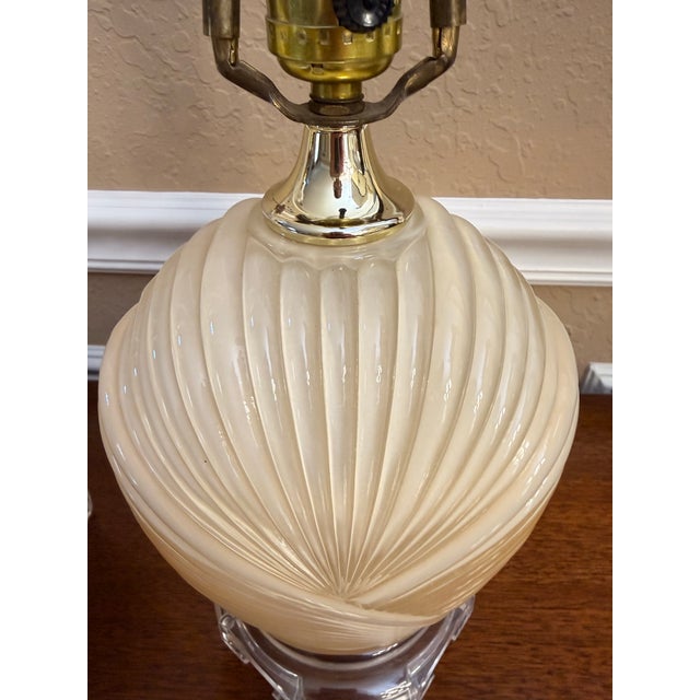 Exude 1980s Postmodern elegance with this striking, matching pair of vintage Shell Grotto style table lamps manufactured...