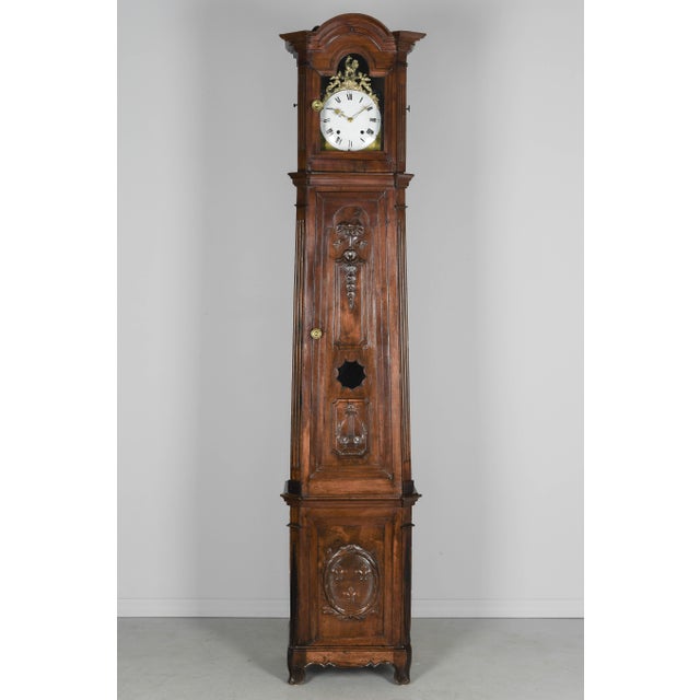 A fine early 19th century French Horloge De Parquet, or tall case clock, from Provence made of solid walnut. The case is...