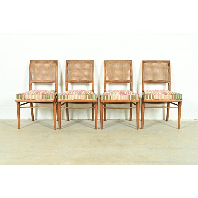 A gorgeous set of four Mid-Century Modern side chairs or dining chairs In the manner of T.H. Robsjohn-Gibbings By...