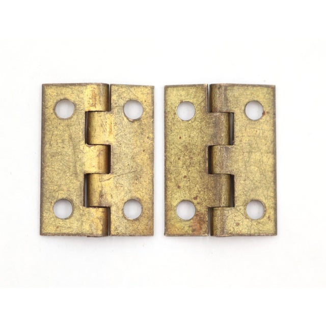 Solid brushed brass vintage furniture or cabinet hinges with five knuckles, flat tips, and a template hole pattern. The...