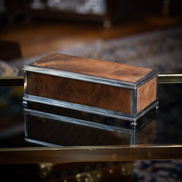 Antique 20th Century American solid silver and burr walnut box, of elegant rectangular form with richly figured burr...