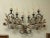 Representative wall lamp with florally composed decor, made of metal and artistically conceived in the spirit of...