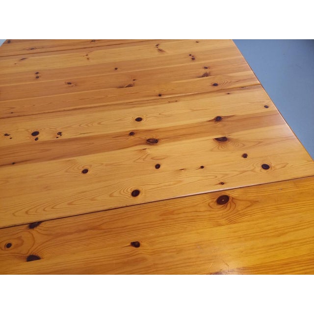 Vintage round table of the 1970s, in pine, in the taste of the Danish designer Rainer Daumiller, central foot with 4...