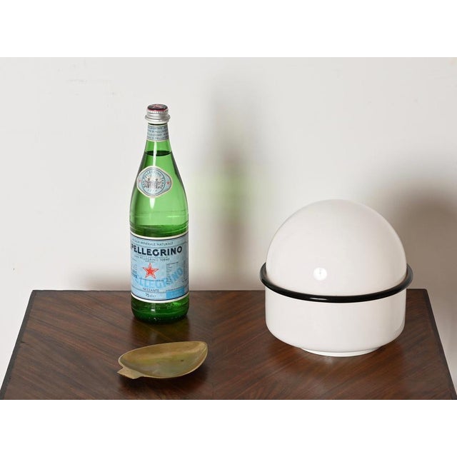 Marvelous pair of white and black “tecla” lamps entirely made of murano blown glass. These elegant lamps were designed by...