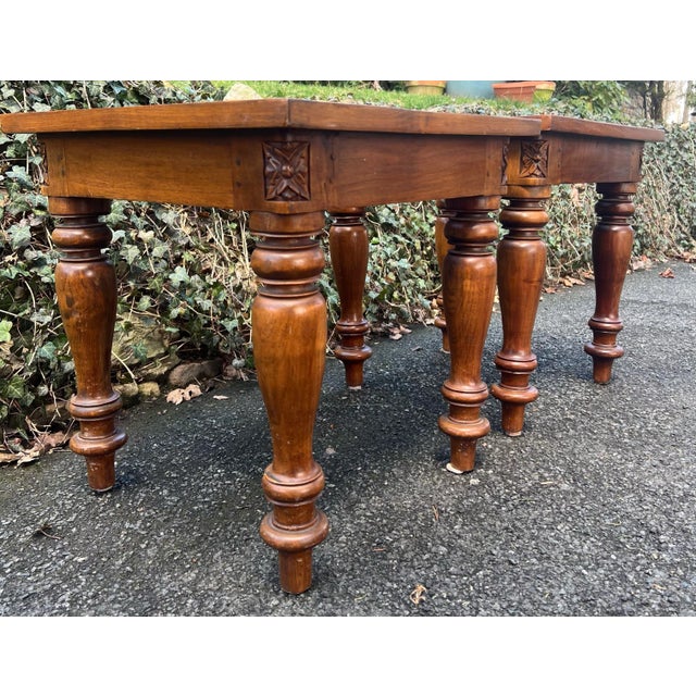 Beautiful pair of wood and cane end tables by Bauer. Chunky turned pine legs and hand caned inset. Carved details on each...