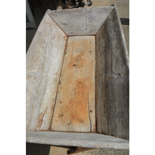 Awesome trencher! It is wooden & does have old holes/weathered. Nothing feels weak at all :-) Great for decoration or...