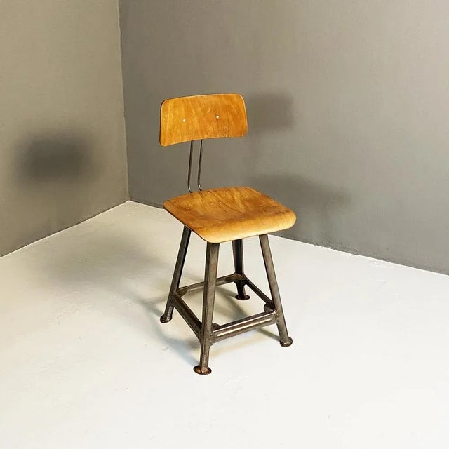 German Mid-Century Modern Industrial wood and metal chair, 1930s. Industrial chair with seat and back in shaped plywood...