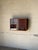 Beautiful vintage Danish teak wall-mounted display cabinet by Cado, featuring clean architectural lines, warm wood tones,...
